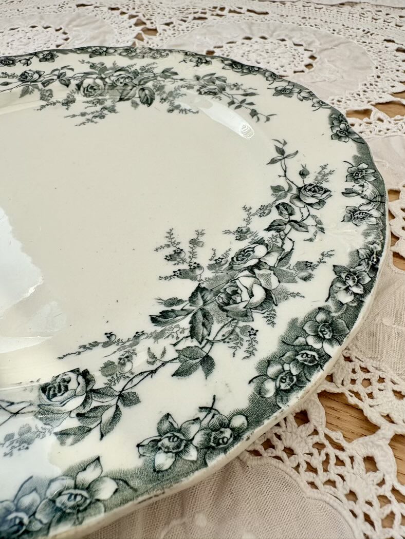 Decorative plate with floral pattern on a lace tablecloth