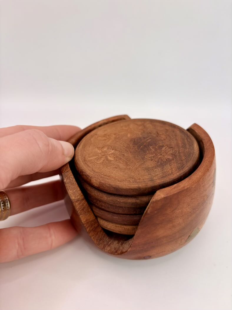 Wooden coaster set with holder on a white background
