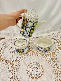 Ceramic teapot pouring into the cup