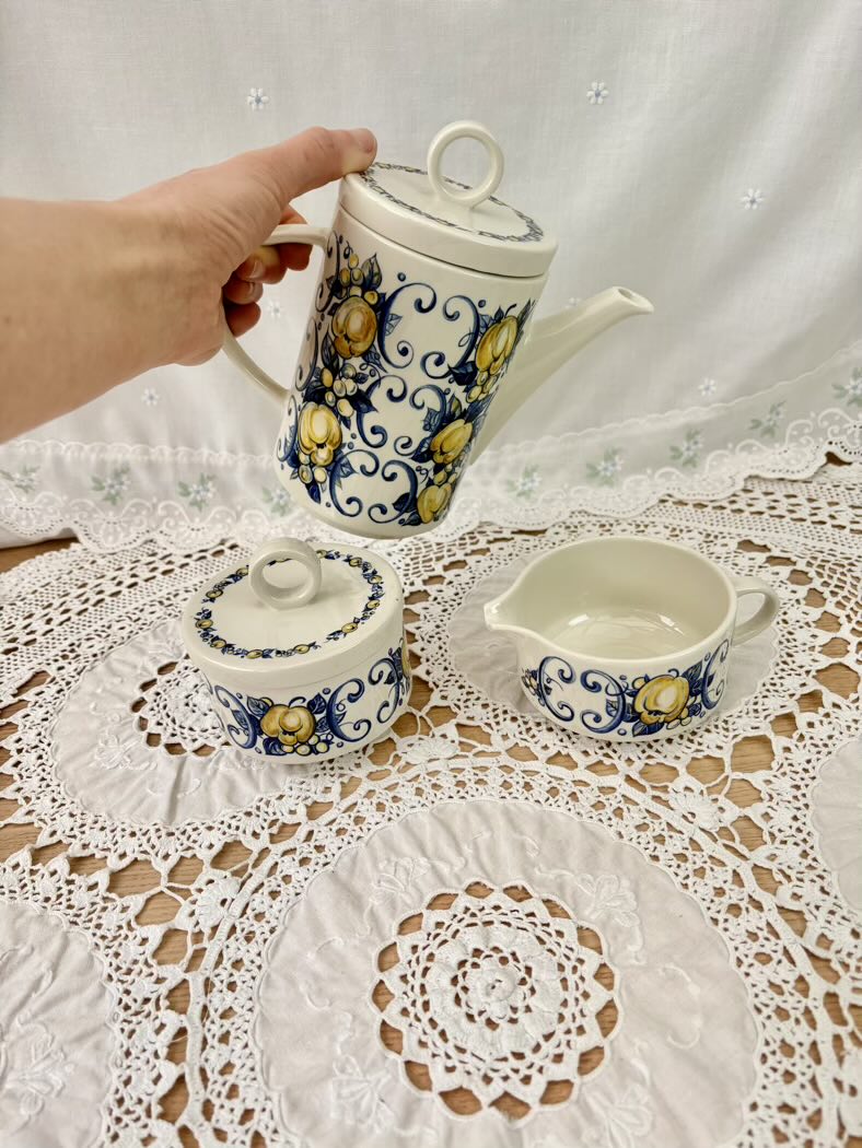 Ceramic teapot pouring into the cup