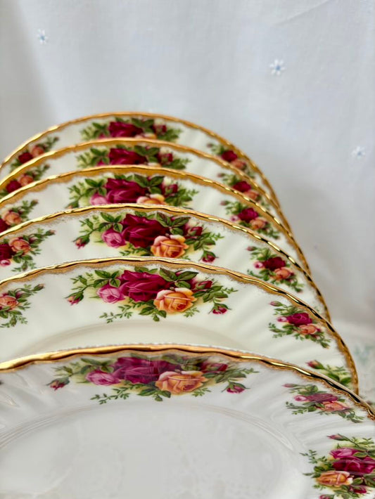 Set of decorative plates with floral patterns on a white background