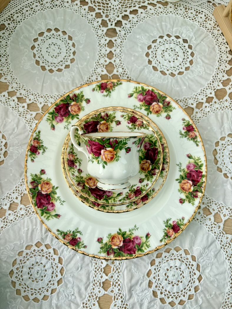 Tea set with floral design on a lace tablecloth