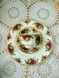 Tea set with floral design on a lace tablecloth