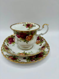 Teacup and saucer set with floral design on a white background