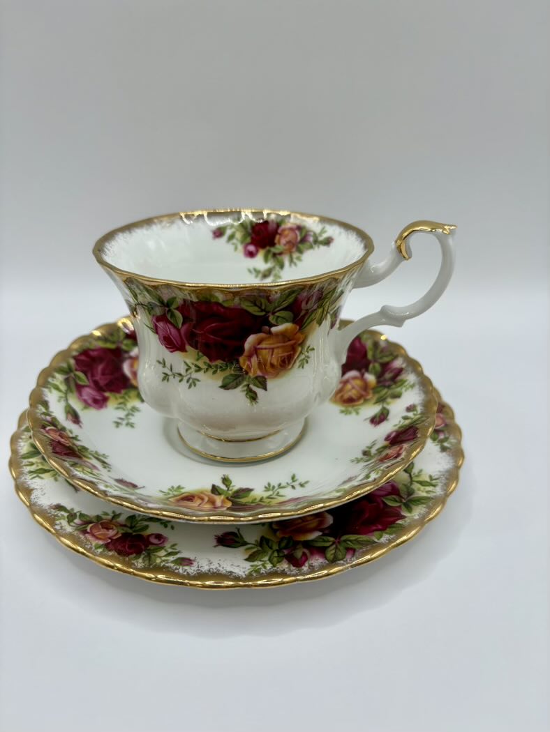 Teacup and saucer set with floral design on a white background