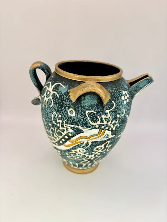 Ceramic vase with decorative design on a white background