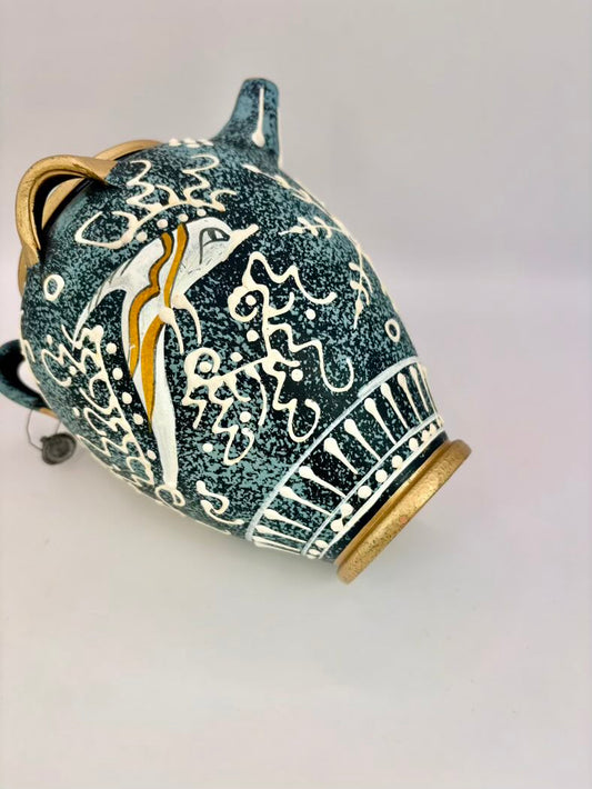 Ceramic jar with decorative patterns on a light gray background