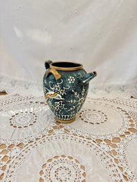 Decorative ceramic vase on a lace tablecloth