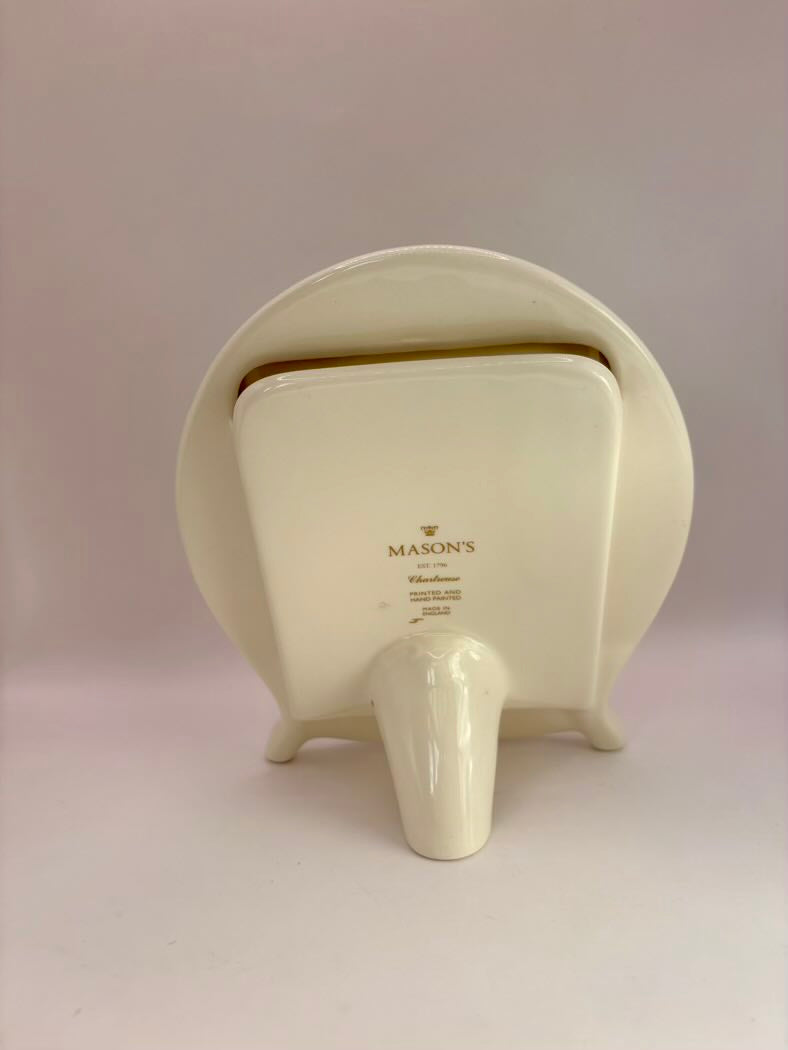 White ceramic elephant with 'Mason's' branding on a light pink background
