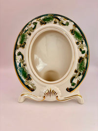 Decorative ceramic plate with intricate designs on a plain background