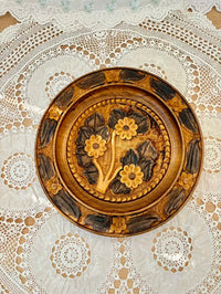 Decorative plate with floral design on a lace tablecloth