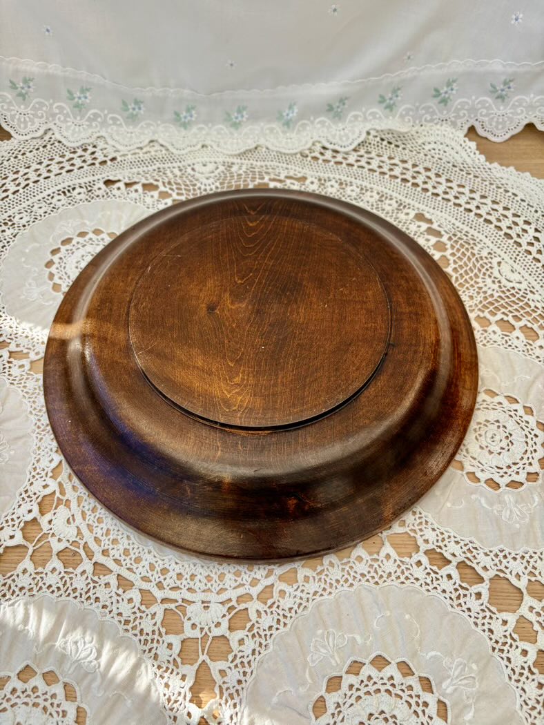 Wooden plate on a lace tablecloth