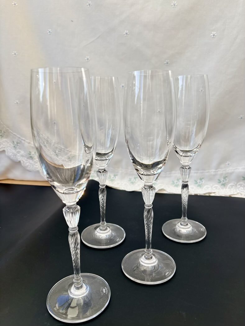 A close-up side view of the flutes highlighting the clarity of the crystal and the elegant stem detail