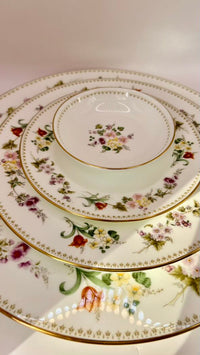 Set of ceramic plates with floral patterns on a white background