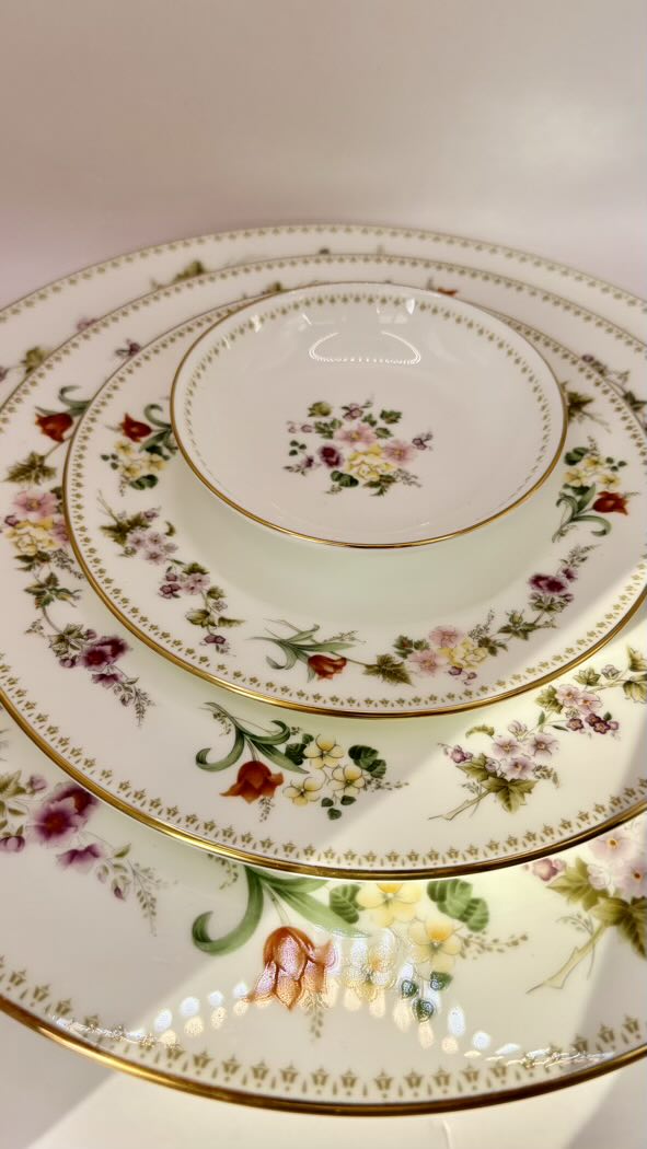 Set of ceramic plates with floral patterns on a white background
