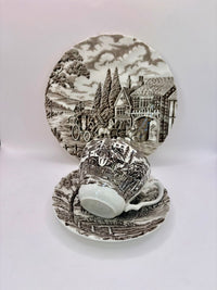 Decorative ceramic plate with a scenic design on a white background