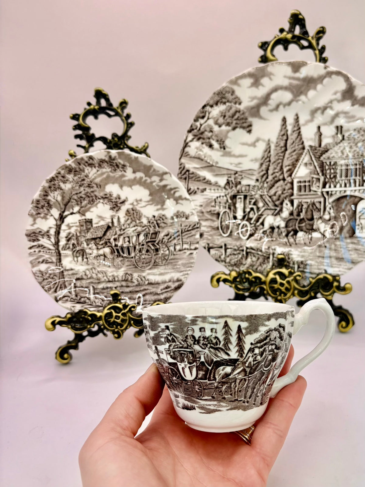 Tea set with scenic design on a light pink background