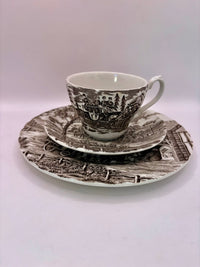 Tea set with a scenic design on a white background