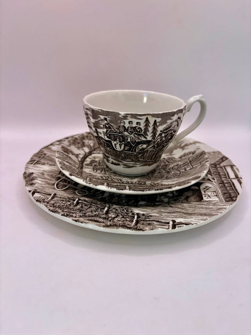 Tea set with a scenic design on a white background