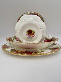 Vintage teacup and saucer with floral design on a white background