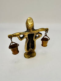 Vintage brass figurine of a boy carrying water buckets, rustic art deco home decor