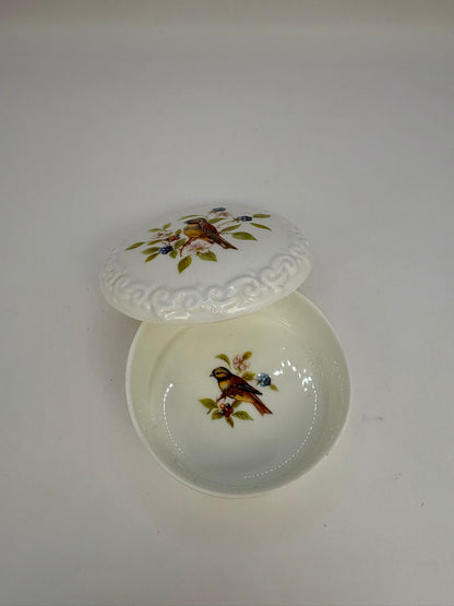 Porcelain trinket box with vintage bird design on lid, perfect for keepsakes