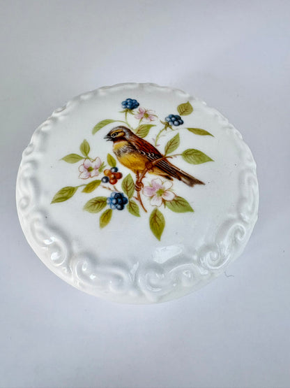 Porcelain trinket box with vintage bird design on lid, perfect for keepsakes