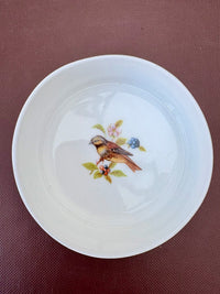 Porcelain trinket box with vintage bird design on lid, perfect for keepsakes