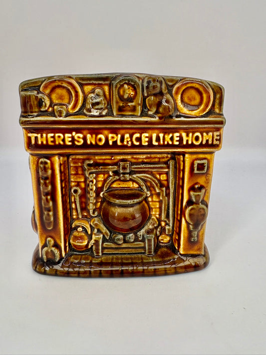 Studio Szeiler glazed ceramic fireplace money box with “There's No Place Like Home” inscription