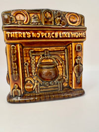 Studio Szeiler glazed ceramic fireplace money box with “There's No Place Like Home” inscription