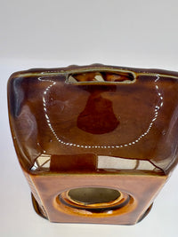 Studio Szeiler glazed ceramic fireplace money box with “There's No Place Like Home” inscription