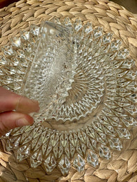 Vintage clear glass dessert set with diamond cut pattern, including bowls, saucers, and a serving plate