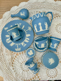 Collection of blue ceramic items with white patterns on