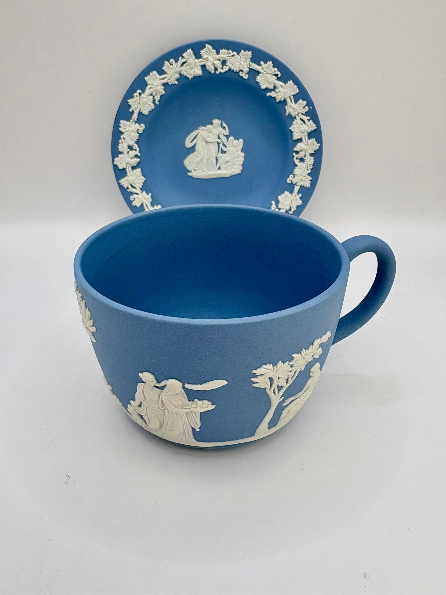Wedgwood blue jasperware teacup and saucer with Roman cameo design
