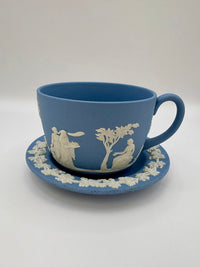 Wedgwood blue jasperware teacup and saucer with Roman cameo design