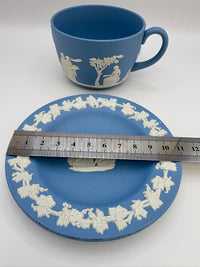 Wedgwood blue jasperware teacup and saucer with Roman cameo design