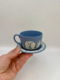 Wedgwood blue jasperware teacup and saucer with Roman cameo design