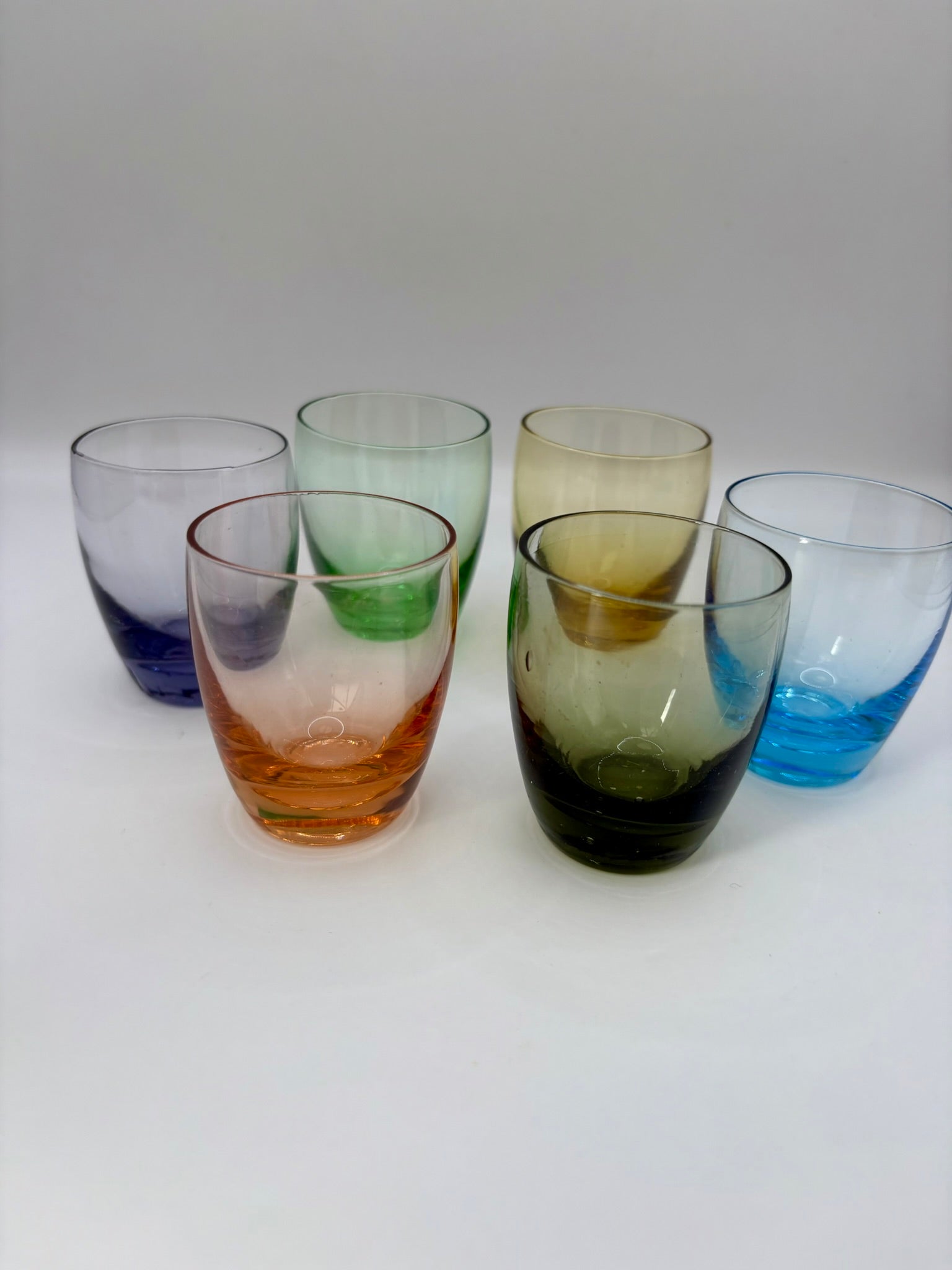 Set of six vintage shot glasses with original 1960s metal cradle