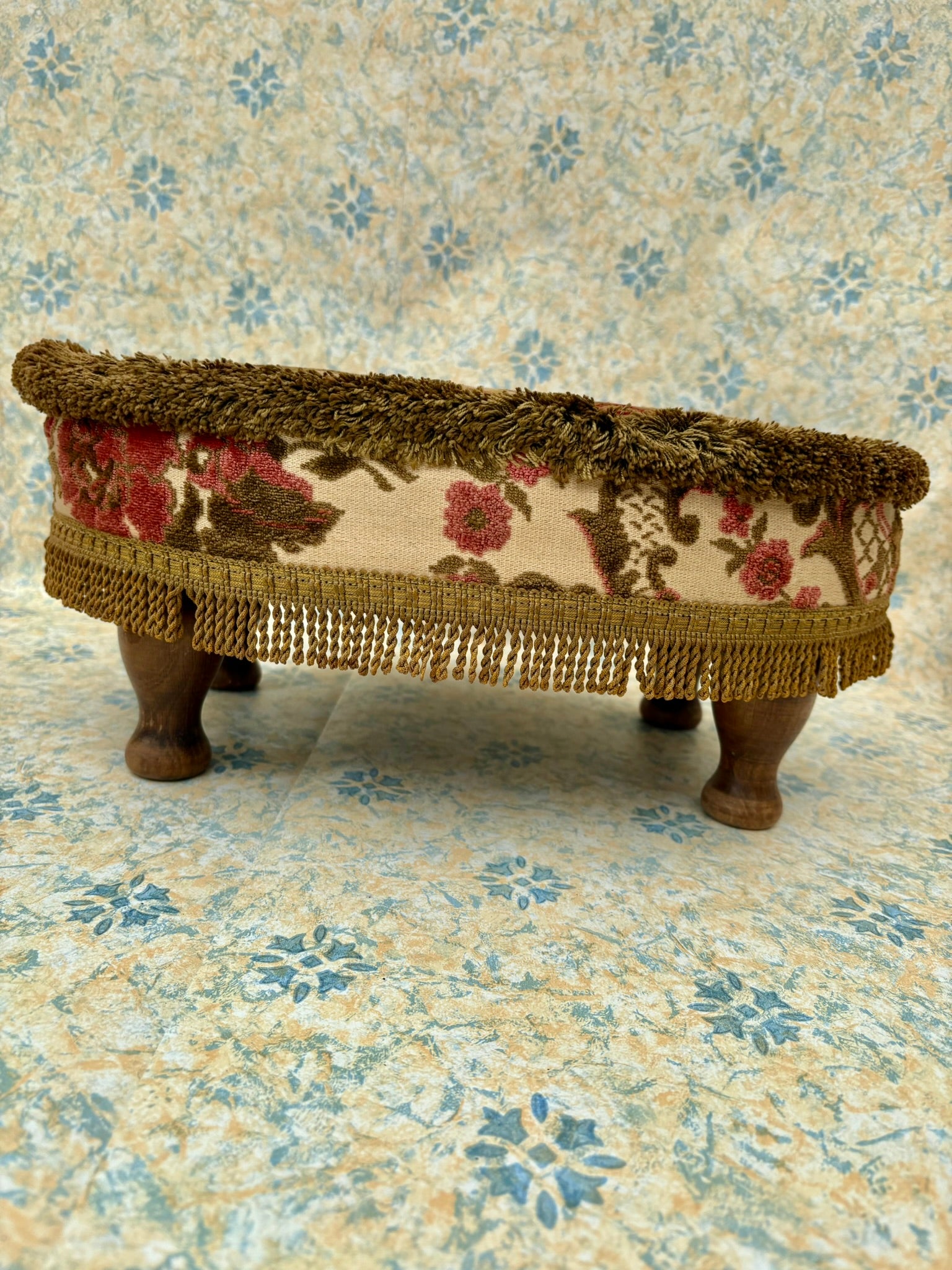 Vintage mid century upholstered wooden foot stool with tapestry sides, tassels and brown velvet top