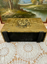 Vintage embossed brass magazine rack featuring a 1960s tavern scene