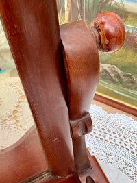 Close-up of original mirror plate with light foxing and mahogany frame