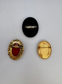 Vintage cameo brooch with elegant Victorian-style design on display
