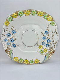 Decorative saucer with floral patterns on a white background