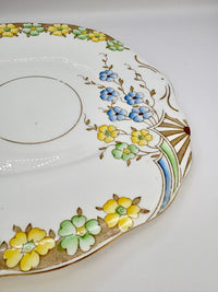Decorative ceramic plate with floral patterns on a white background