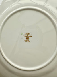 Close-up of a white ceramic plate with 'TRURO Salisbury' branding on a white background