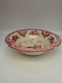 White ceramic bowl with red floral pattern on a white background