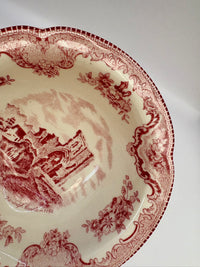Red patterned plate on a white background