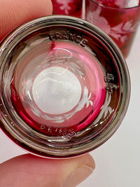Close-up of a shot glass with 'France' branding on a white background