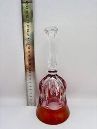 Vintage red and clear crystal bell ornament without ringer on display