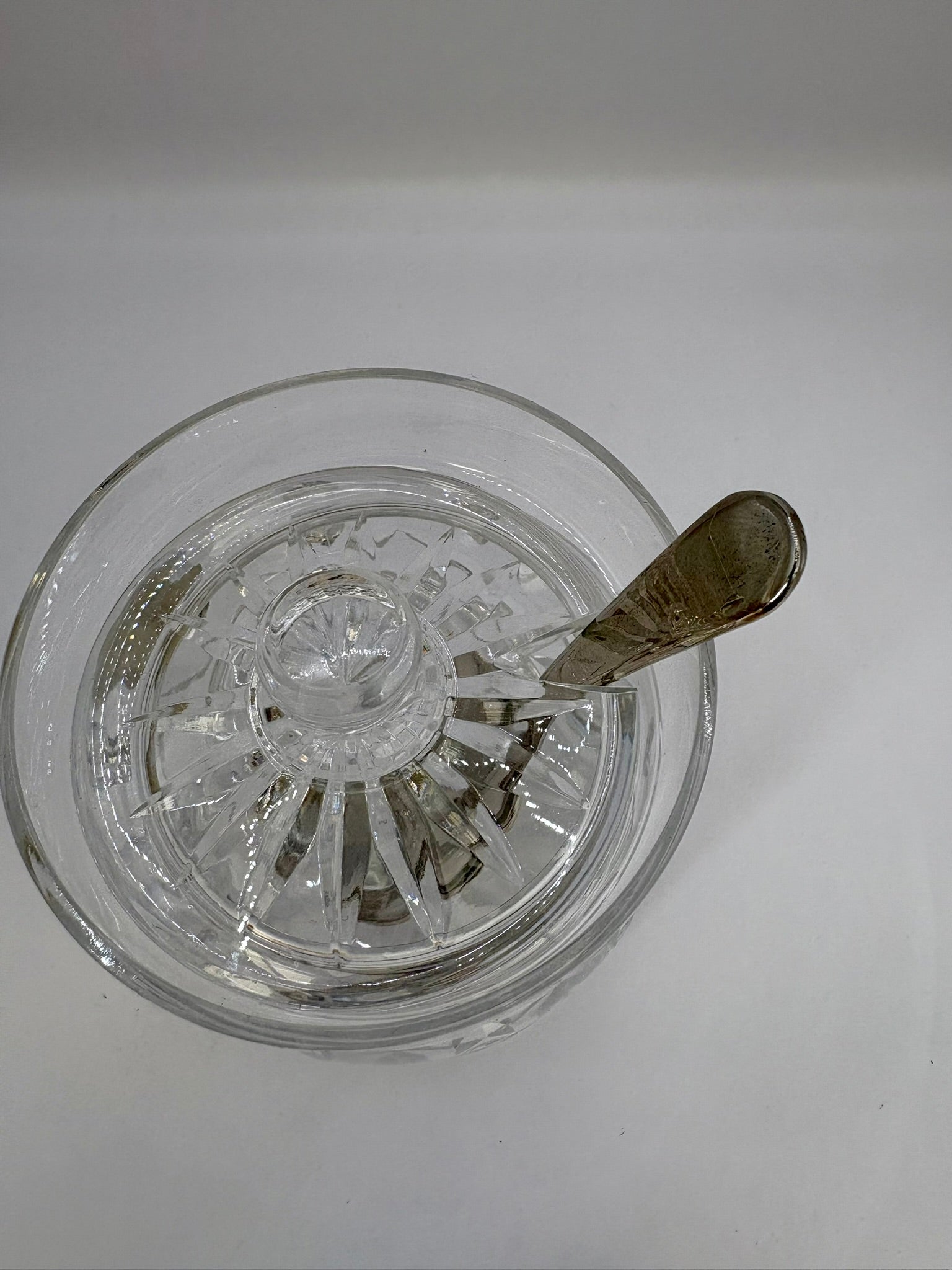 Clear glass bowl with decorative interior design on a white background